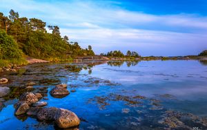 Preview wallpaper coast, trees, stones, lake, sky