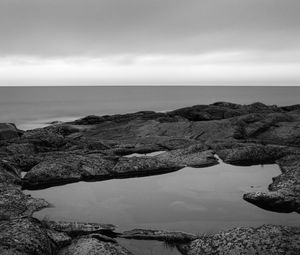 Preview wallpaper coast, water, sea, black and white, horizon