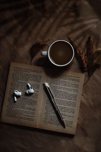 Preview wallpaper coffee, cup, book, headphones, text
