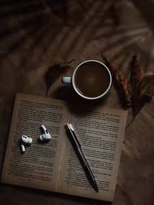 Preview wallpaper coffee, cup, book, headphones, text