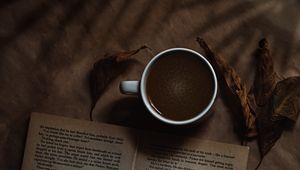 Preview wallpaper coffee, cup, book, headphones, text