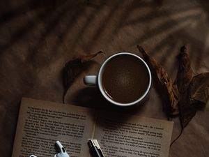 Preview wallpaper coffee, cup, book, headphones, text