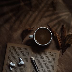 Preview wallpaper coffee, cup, book, headphones, text