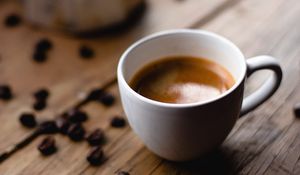 Preview wallpaper coffee, cup, coffee beans, surface, wooden