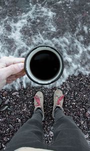 Preview wallpaper coffee, cup, legs, hand, pebbles, sea