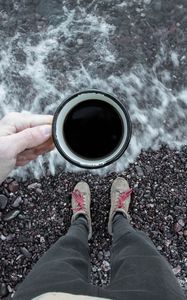 Preview wallpaper coffee, cup, legs, hand, pebbles, sea