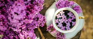 Preview wallpaper coffee, cup, lilac, flowers, wooden