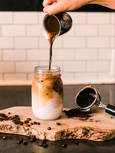 Preview wallpaper coffee, drink, glass, coffee beans, milk, hand