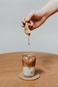 Preview wallpaper coffee, drink, ice, hand, spoon, drops