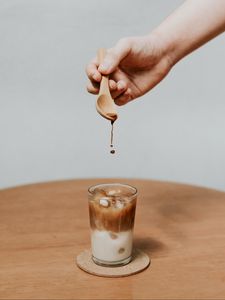 Preview wallpaper coffee, drink, ice, hand, spoon, drops