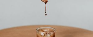 Preview wallpaper coffee, drink, ice, hand, spoon, drops