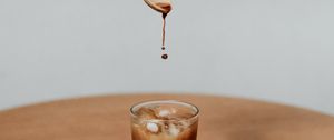 Preview wallpaper coffee, drink, ice, hand, spoon, drops