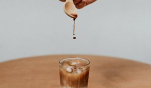 Preview wallpaper coffee, drink, ice, hand, spoon, drops