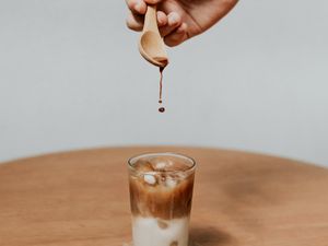 Preview wallpaper coffee, drink, ice, hand, spoon, drops