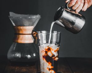 Preview wallpaper coffee, glass, hand, milk, ice, drink