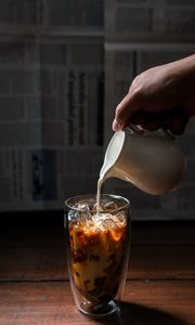 Preview wallpaper coffee, milk, ice, glass, hand