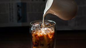 Preview wallpaper coffee, milk, ice, glass, hand