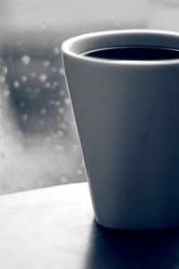 Preview wallpaper coffee, mug, glass, window, drops, rain, grief, black-and-white