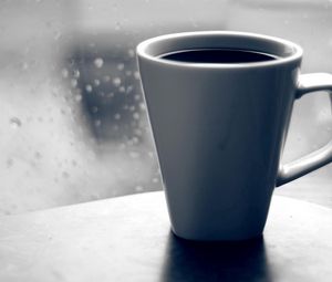 Preview wallpaper coffee, mug, glass, window, drops, rain, grief, black-and-white