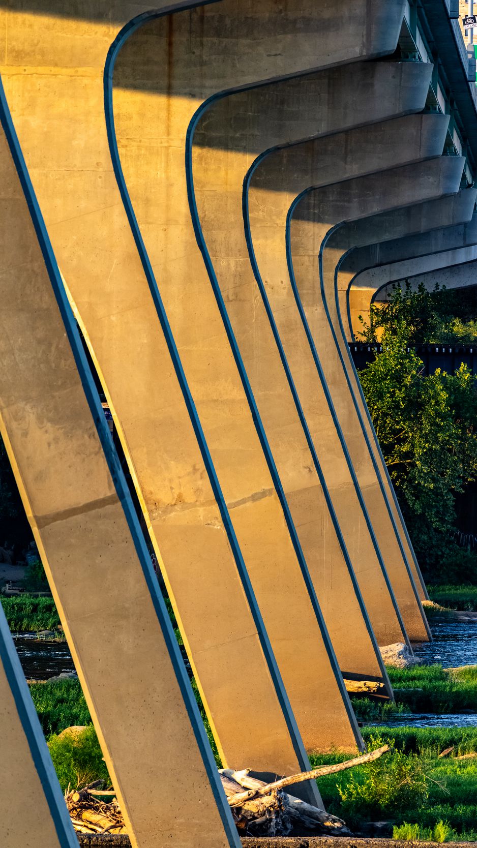 938x1668 Wallpaper columns, bridge, river, grass, city