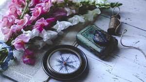 Preview wallpaper compass, flowers, newspaper, aesthetics