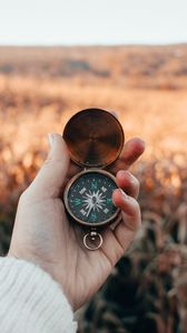 Preview wallpaper compass, hand, fingers, travel