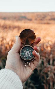 Preview wallpaper compass, hand, fingers, travel