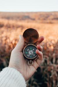 Preview wallpaper compass, hand, fingers, travel