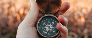 Preview wallpaper compass, hand, fingers, travel