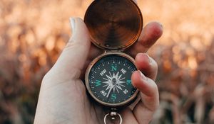 Preview wallpaper compass, hand, fingers, travel