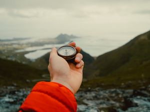 Preview wallpaper compass, hand, mountains, nature