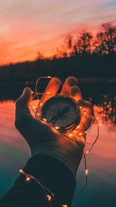 Preview wallpaper compass, hands, sunset, light