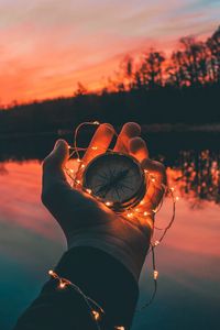 Preview wallpaper compass, hands, sunset, light