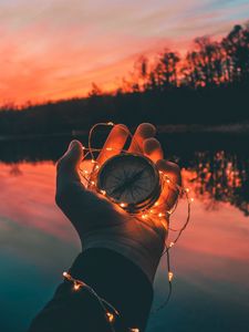 Preview wallpaper compass, hands, sunset, light