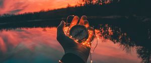 Preview wallpaper compass, hands, sunset, light