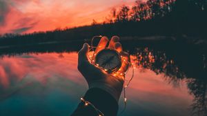 Preview wallpaper compass, hands, sunset, light