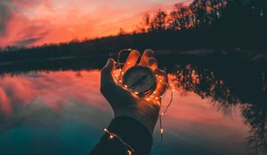 Preview wallpaper compass, hands, sunset, light