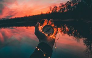 Preview wallpaper compass, hands, sunset, light