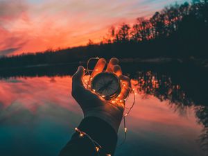 Preview wallpaper compass, hands, sunset, light