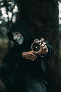 Preview wallpaper compass, man, mask, anonymous, hood