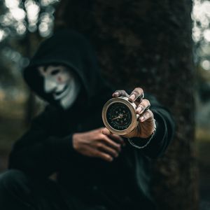 Preview wallpaper compass, man, mask, anonymous, hood