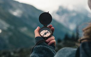 Preview wallpaper compass, travel, hand, focus