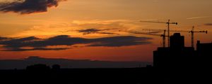 Preview wallpaper construction cranes, buildings, silhouettes, sunset, dark