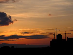 Preview wallpaper construction cranes, buildings, silhouettes, sunset, dark