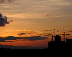 Preview wallpaper construction cranes, buildings, silhouettes, sunset, dark