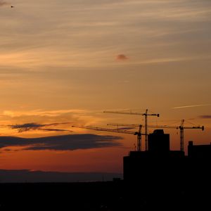 Preview wallpaper construction cranes, buildings, silhouettes, sunset, dark