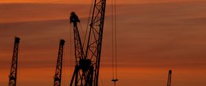 Preview wallpaper construction cranes, sunset, silhouettes