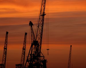 Preview wallpaper construction cranes, sunset, silhouettes