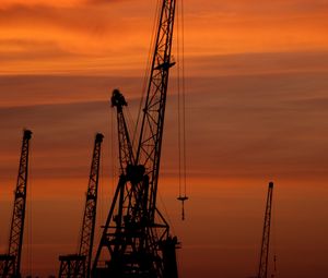 Preview wallpaper construction cranes, sunset, silhouettes