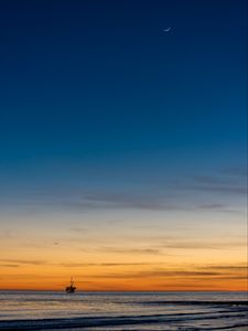 Preview wallpaper construction, sea, sunset, horizon, moon